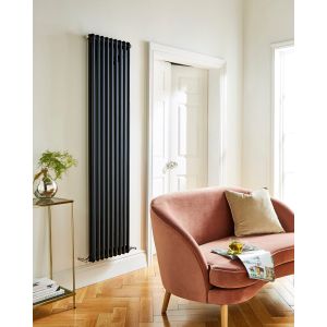 1800 x 515mm 2 column vertical radiator in matt black - styled living room with velvet armchair - Kartell Laser Klassic