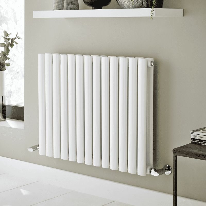 White oval-column designer radiator in a modern living room