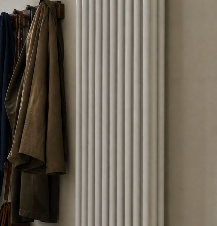 White vertical designer radiator in a hallway